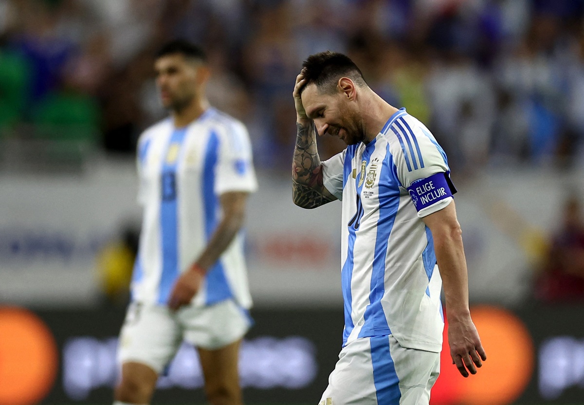 Lionel Messi reacts after failing to score in the penalty shoot-out.