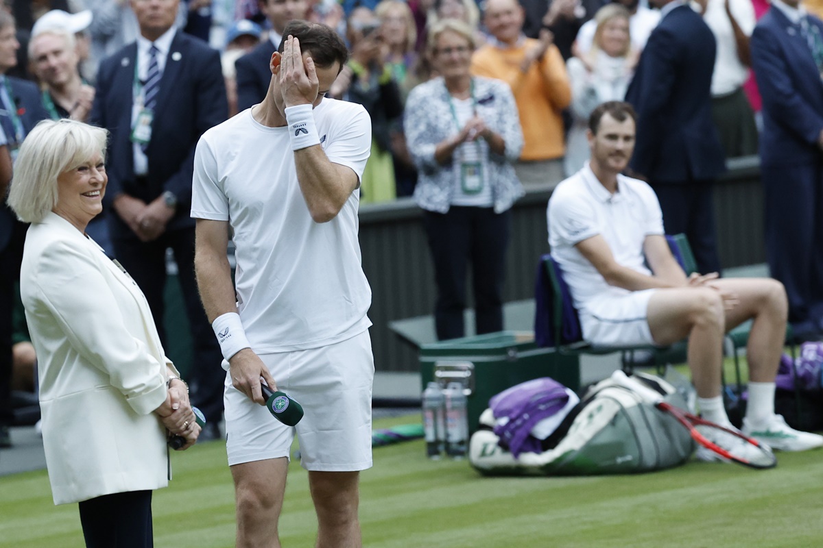 Andy Murray gets emotional during a ceremony honouring his Wimbledon career, emceed by former BBC presenter Sue Barker (left) after the men's doubles match with brother Jamie Murray against Rinky Hijikata and John Peers.