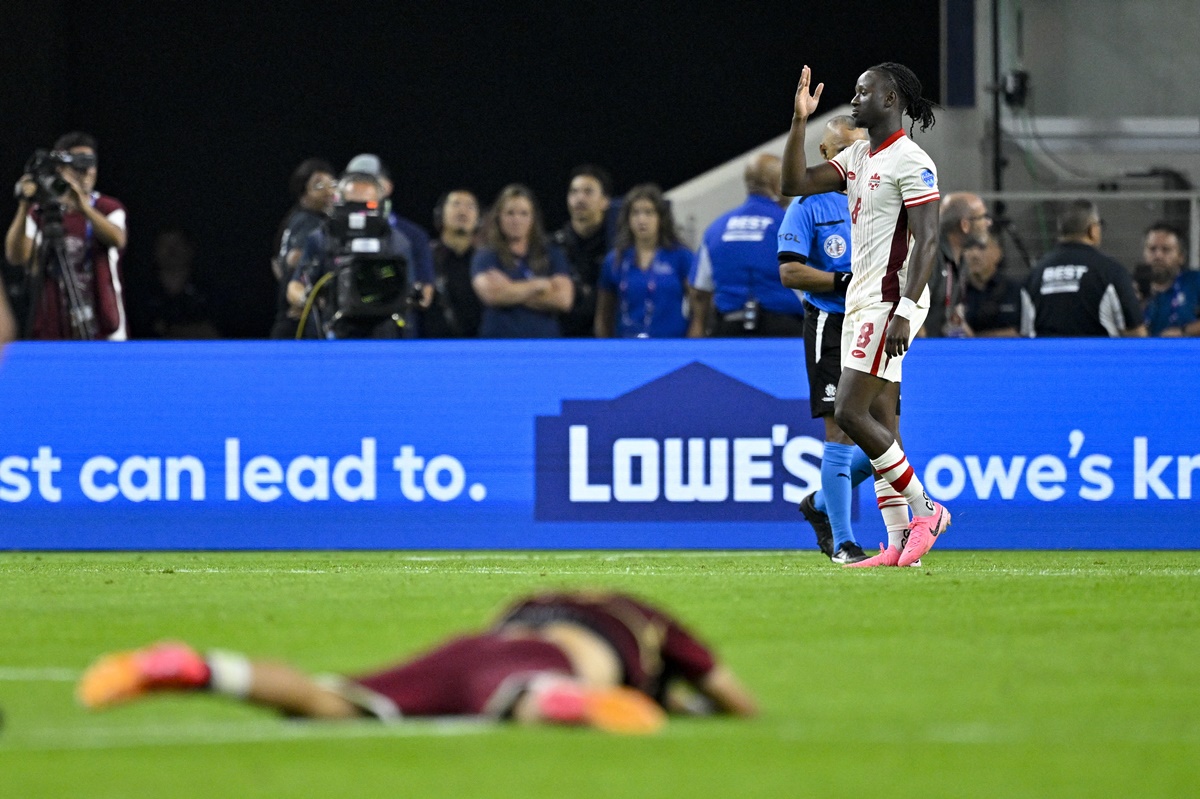 Ismael Kone celebrates scoring the match-winner for Canada in the penalty shoot-out.