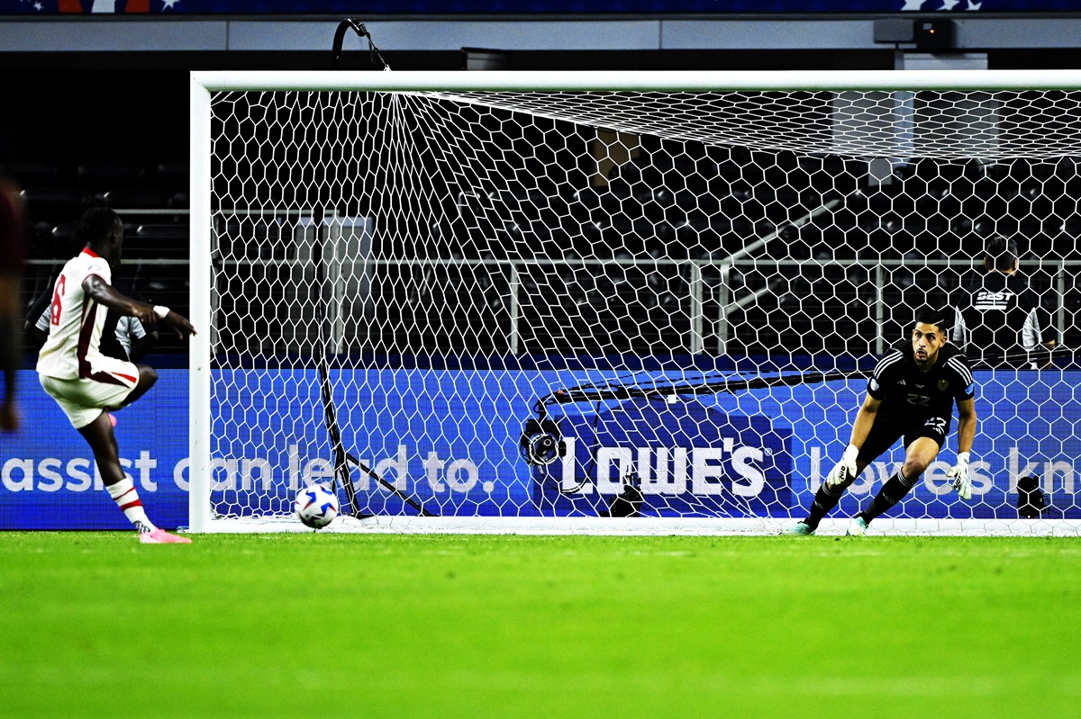 Ismael Kone (No. 8) beats Venezuela goalkeeper Rafael Romo during the penalty shoot-out to give Canada victory in the 2024 Copa America quarter-final at AT&T stadium, Arlington, Texas, on Friday..