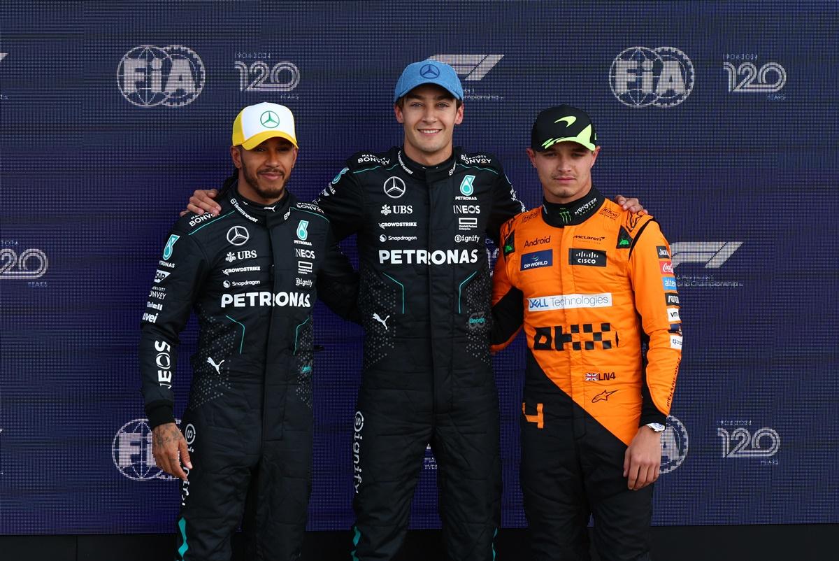 Mercedes's George Russell poses after qualifying in pole position for the British Grand Prix with second and third-placed teammates Lewis Hamilton and Lando Norris at Silverstone Circuit, Silverstone, Britain, on Saturday.