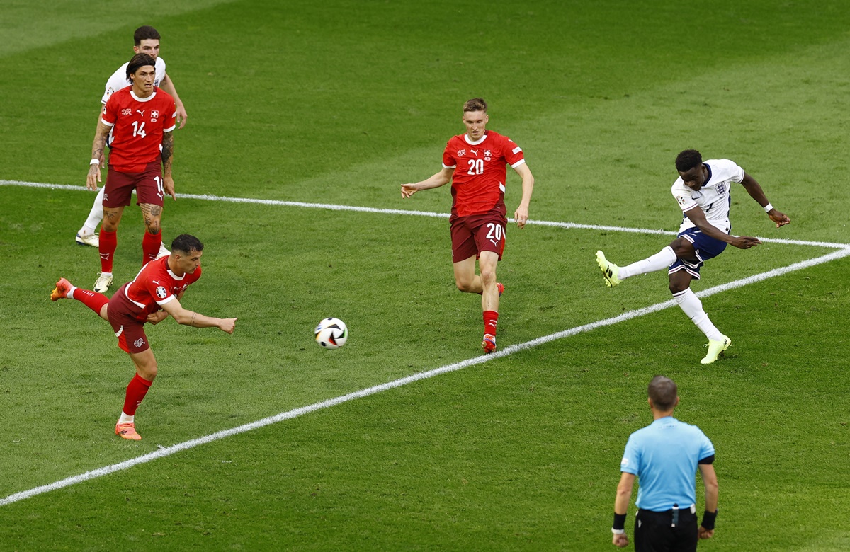 Bukayo Saka scores with a stiff left-footer from the top of the box to restore parity for England.