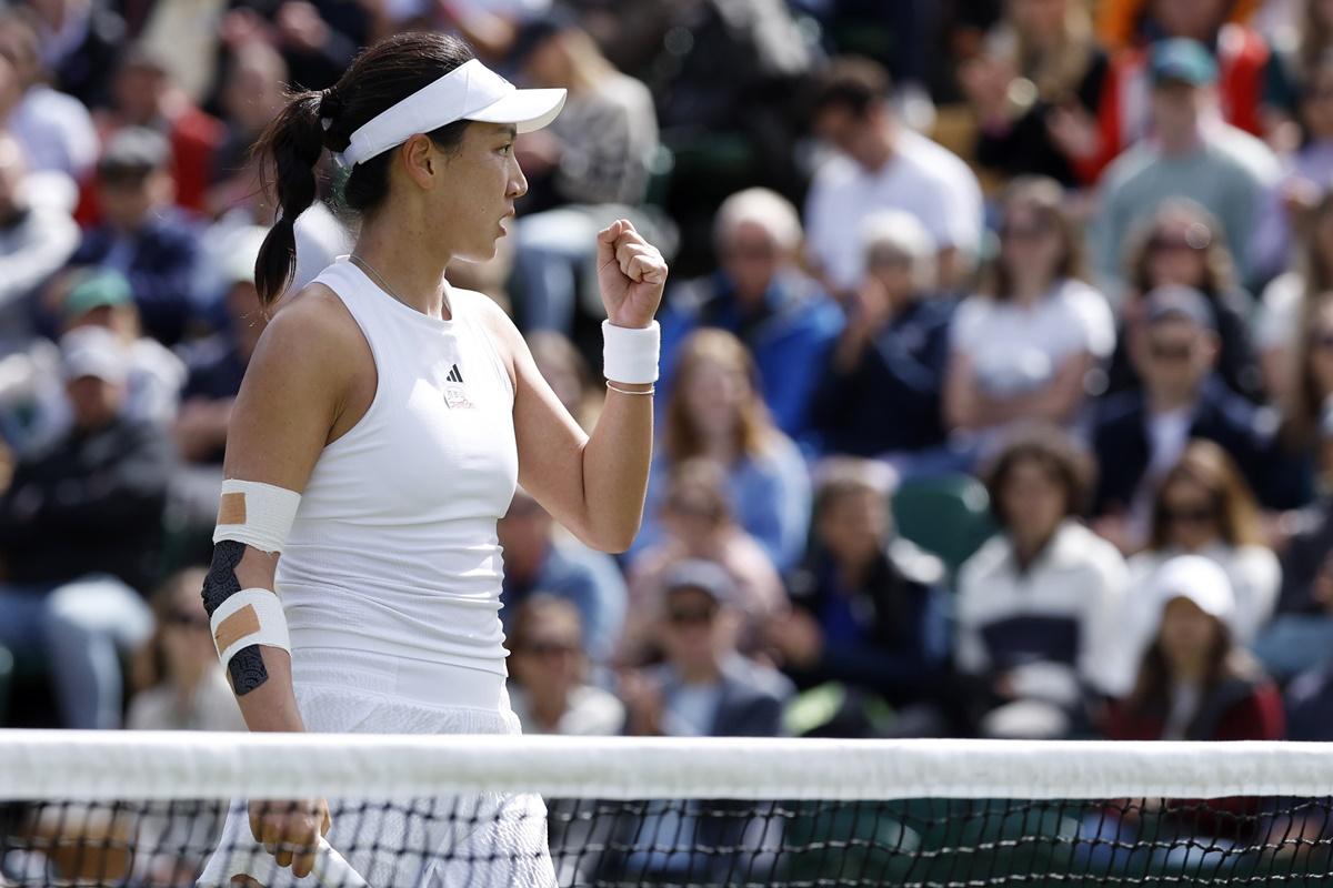 China's Xinyu Wang celebrates winning the second set against Brtain's Harriett Dart in the ladies' singles at the Wimbledon Championships on Saturday. 