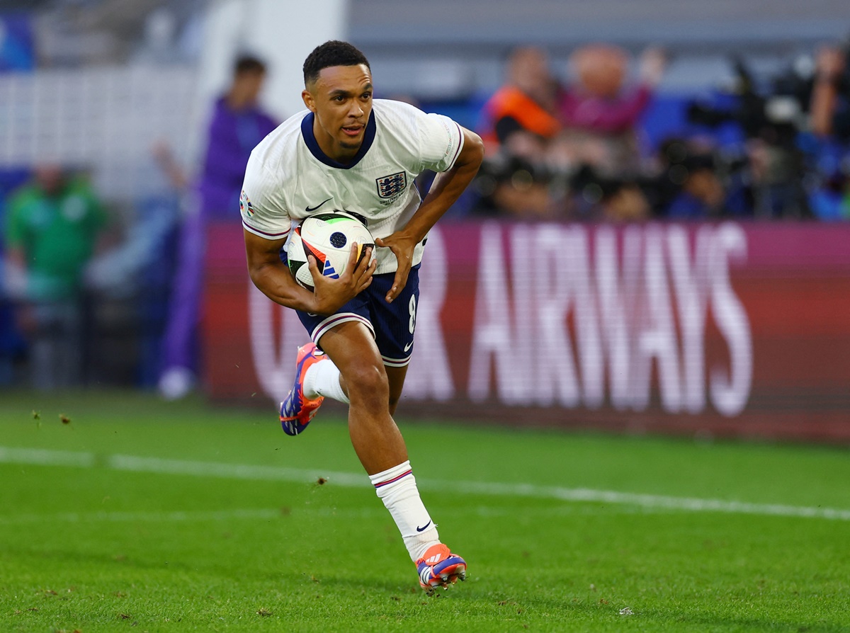 Trent Alexander-Arnold breaks into celebration after scoring the match-winner in the penalty shoot-out.