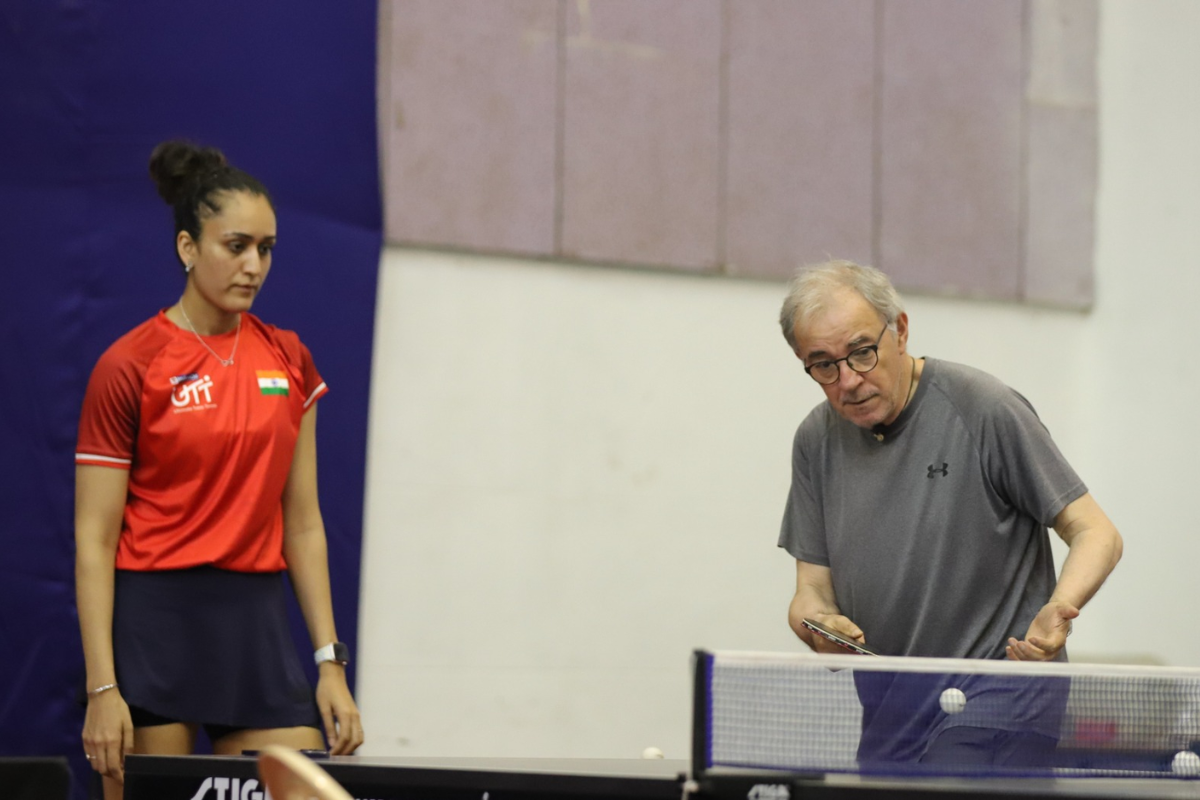 India's Italian Head Coach Massimo Costantini with Manika Batra