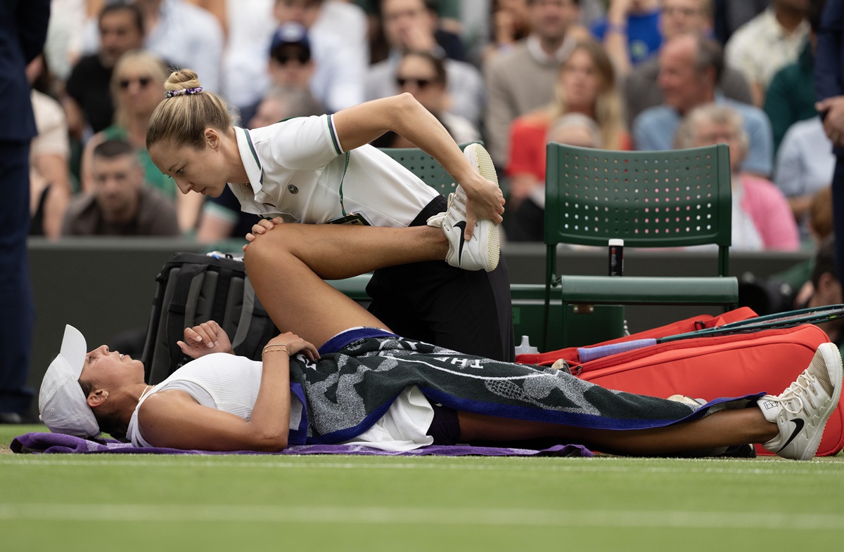 Madison Keys receives treatment during a medical time out in her during her match against Jasmine Paolini.