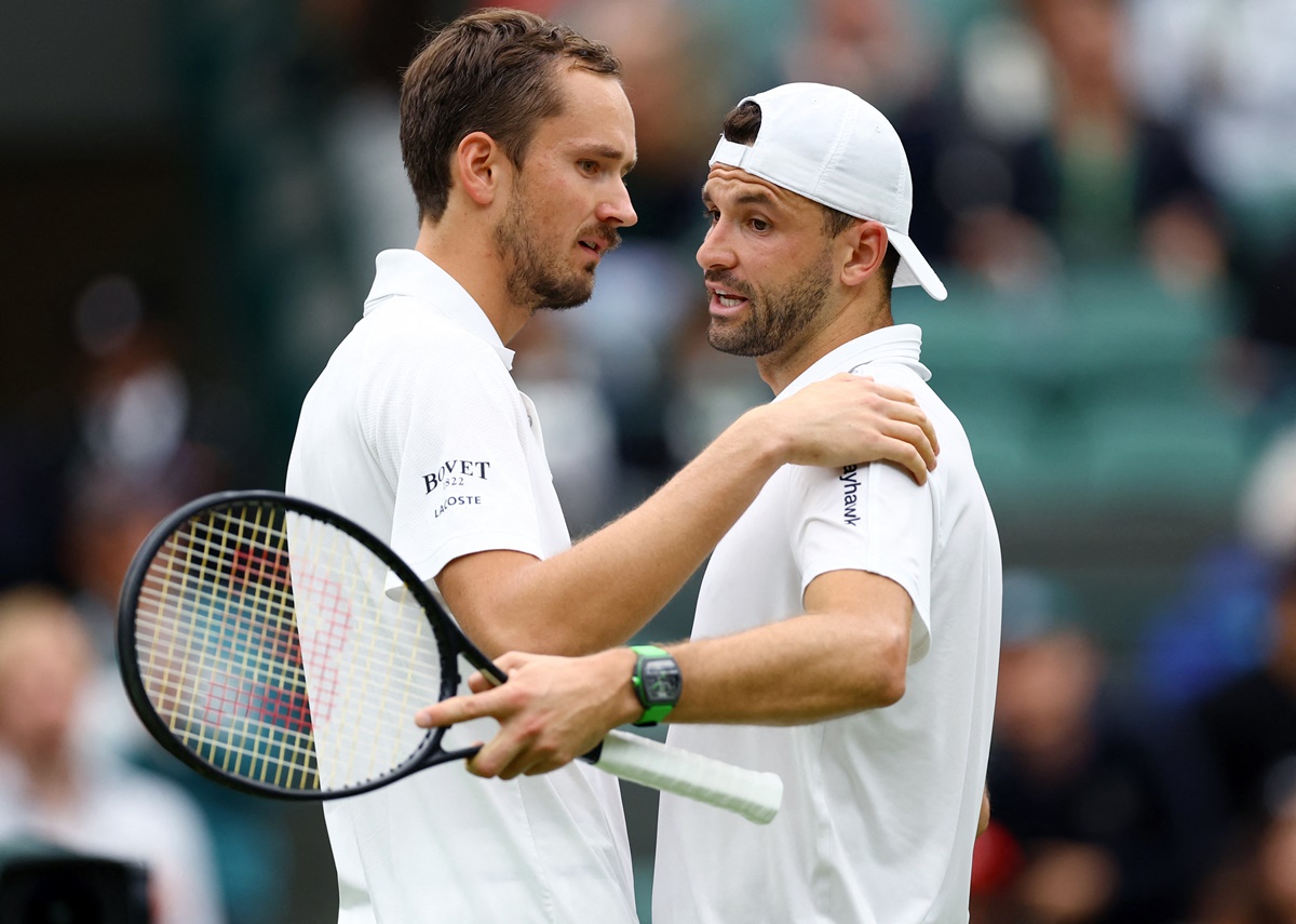 Grigor Dimitrov is consoled by Daniil Medvedev after retiring injured from their fourth round match.