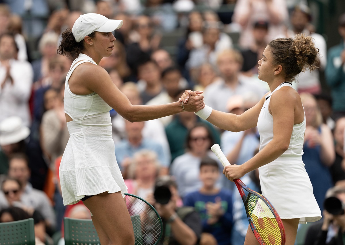 Madison Keys of the United States embraces Italy's Jasmine Paolini after injury forces her to retire from their match.