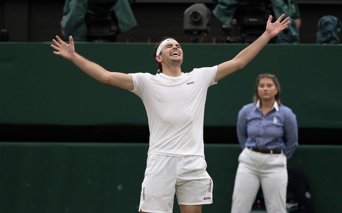 Taylor Fritz celebrates coming back from two sets down and beating Alexander Zverev.