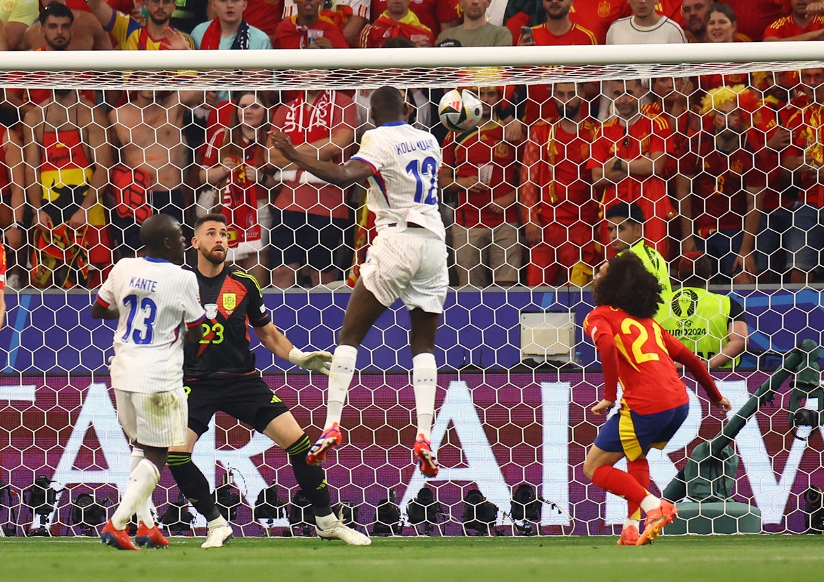 Randal Kolo Muani (No. 12) heads home a floater from Kylian Mbappe to put France ahead.