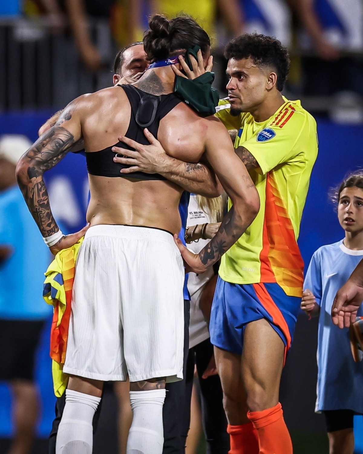 Darwin Nunez is comforted by his Liverpool teammate, Columbia's Luiz Diaz
