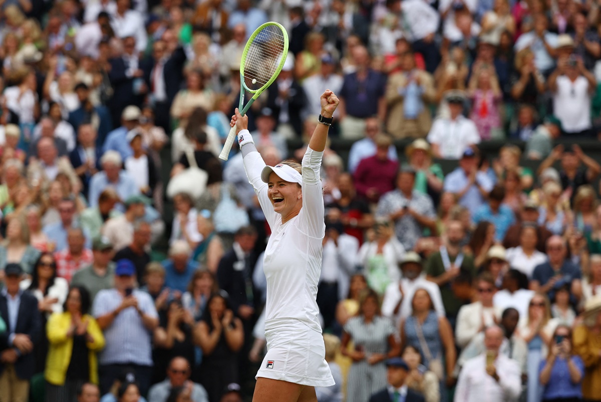 The Czech Republic's Barbora Krejcikova raises her arms in triumph after beating Kazakhstan's Elena Rybakina in the second ladies singles semi-final at the Wimbledon Championships, in London, on Thursday.