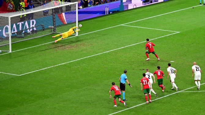 Slovenia's goalkeeper Jan Oblak saves the penalty by Cristiano Ronaldo