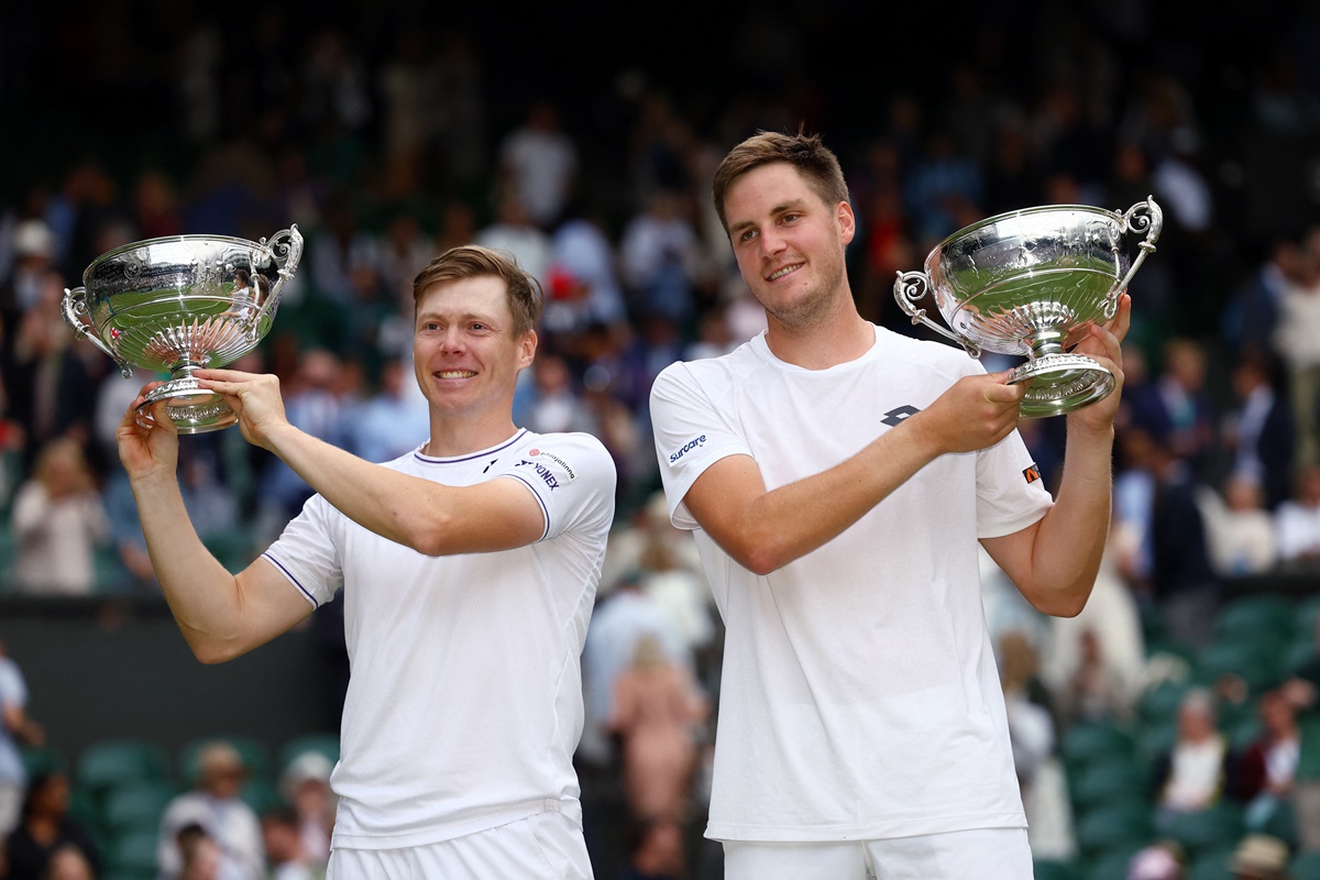 Britain's Henry Patten and Finland's Harri Heliovaara celebrate with their trophies after winning the men's doubles final against Australia's Max Purcell and Australia's Jordan Thompson at the Wimbledon Championships, in London, on Saturday.