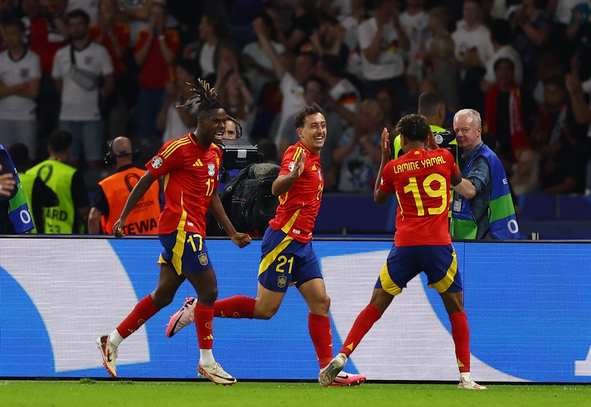 Substitute Mikel Oyarzabal, who became the 10th Spain player to score at Euro 2024, celebrates scoring their second goal with Nico Williams and Lamine Yamal.