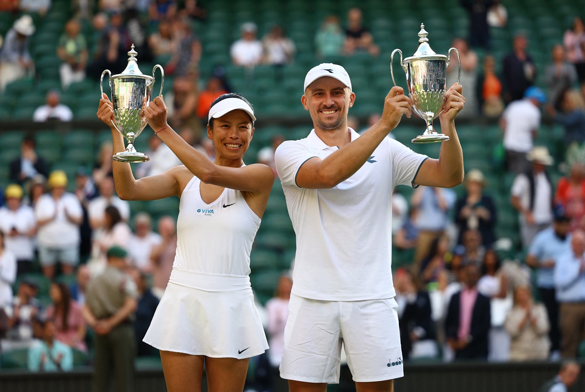 Poland's Jan Zielinski and Taiwan's Su-Wei Hsieh pose for a picture with their trophies after winning the Wimbledon mixed doubles final against Mexico's Santiago Gonzalez and Giuliana Olmos on Sunday.