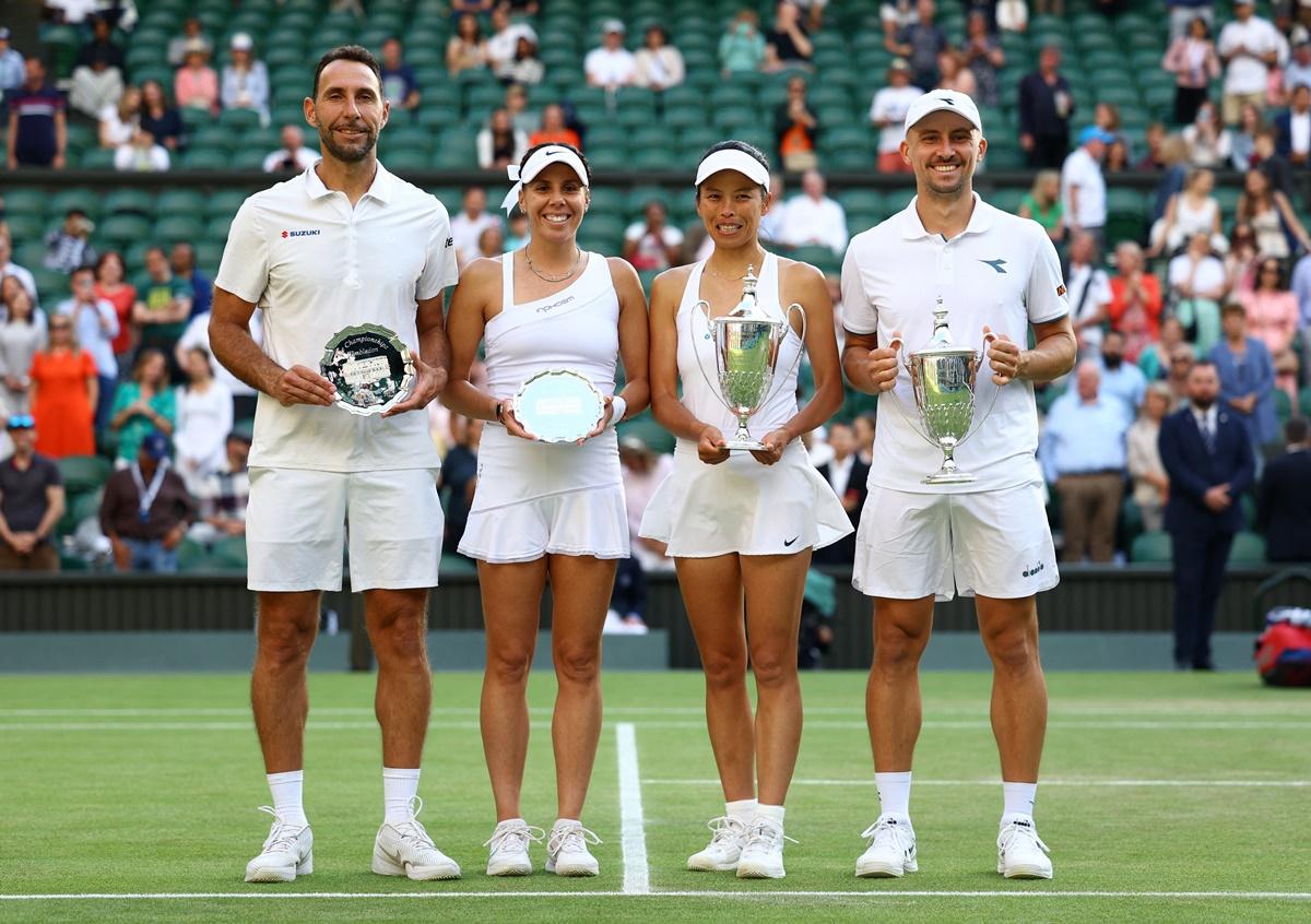 Champions Jan Zielinski and Su-Wei Hsieh and runners-up Mexico's Santiago Gonzalez and Giuliana Olmos pose for a picture with their trophies after the mixed doubles final.