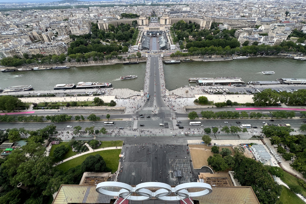 The Olympic rings are displayed on the Eiffel Tower with a general view of Champions Park at the Trocadero, under construction for the Paris 2024 Olympic and Paralympic Games in Paris, France