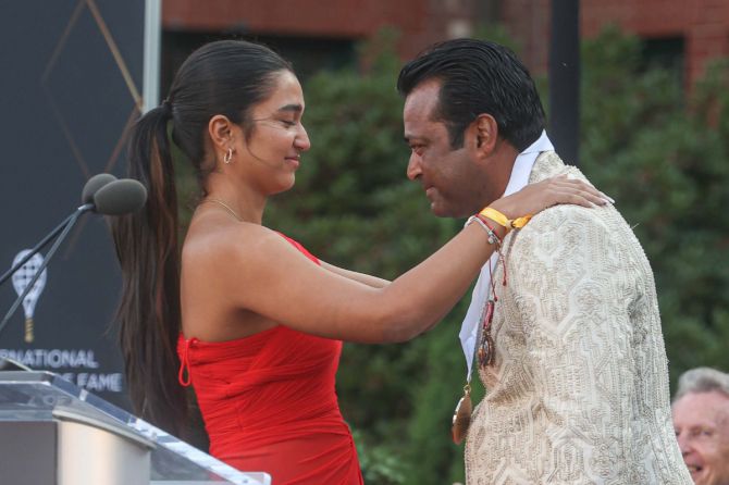 Indian tennis legend Leander Paes receives the International Tennis Hall of Fame medal from daughter Aiyana Paes on Saturday, July 20.