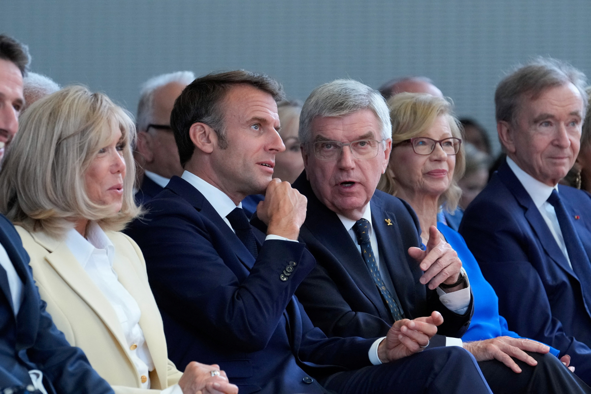 International Olympic Committee President Thomas Bach, French President Emmanuel Macron, his wife Brigitte Macron, and LVMH CEO Bernard Arnault attend the IOC Session Opening Ceremony at the Louis Vuitton Foundation ahead of the 2024 Summer Olympics, on Monday, July 22, 2024, in Paris, France