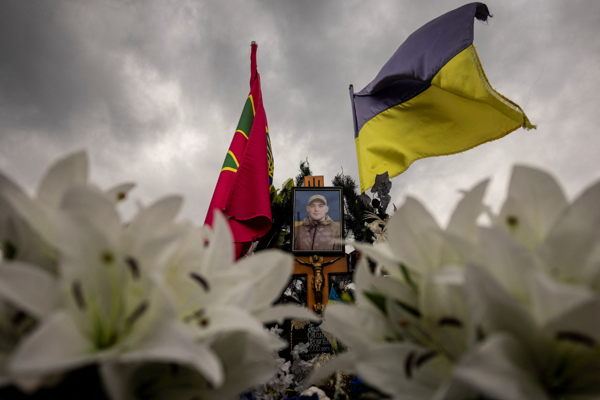 A Ukrainian flag flies over the grave of judoka Stanislav Hulenkov, who was killed fighting against Russia's invasion, in Lutsk, amid Russia's attack on Ukraine, July 18, 2024