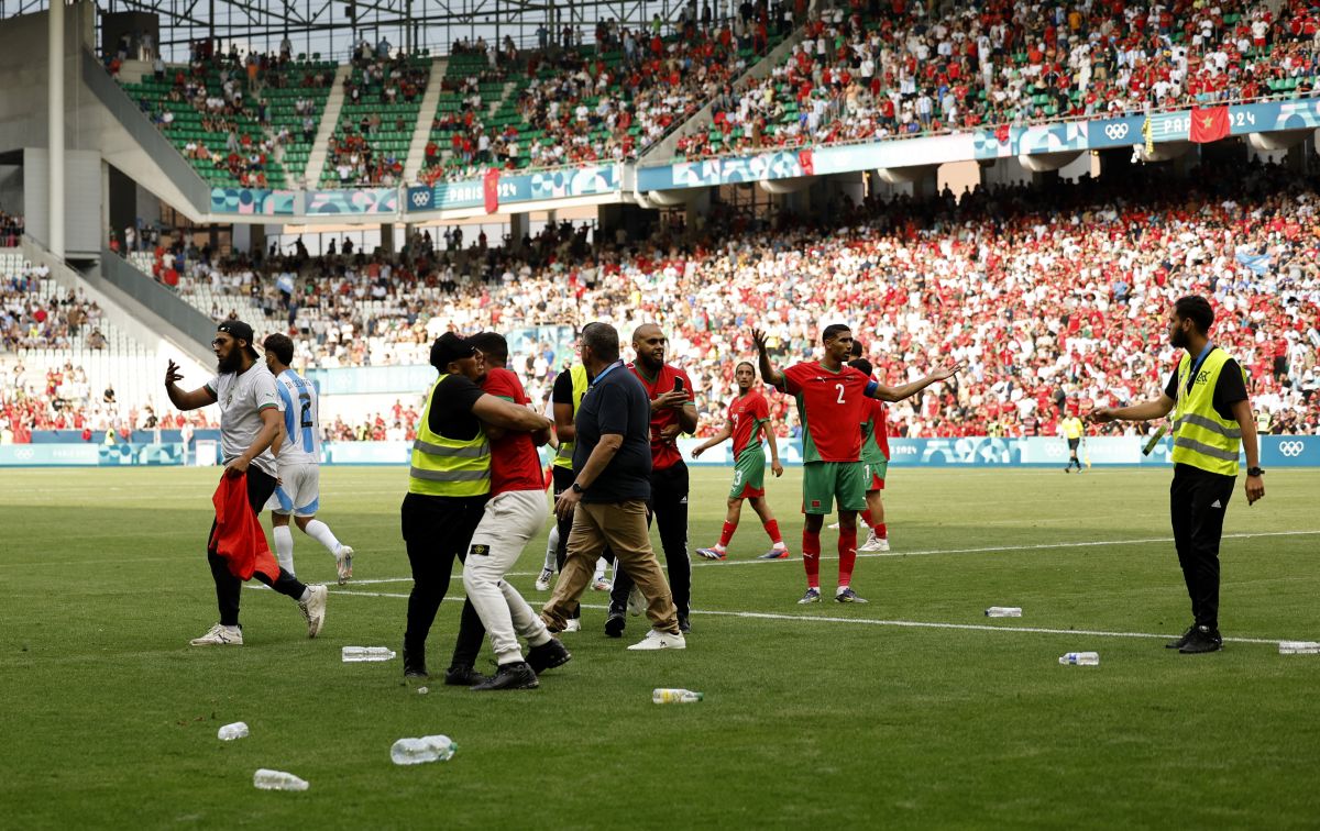 Morocco's Achraf Hakimi reacts as spectators run onto the pitch after Argentina score at the fag end of the match.