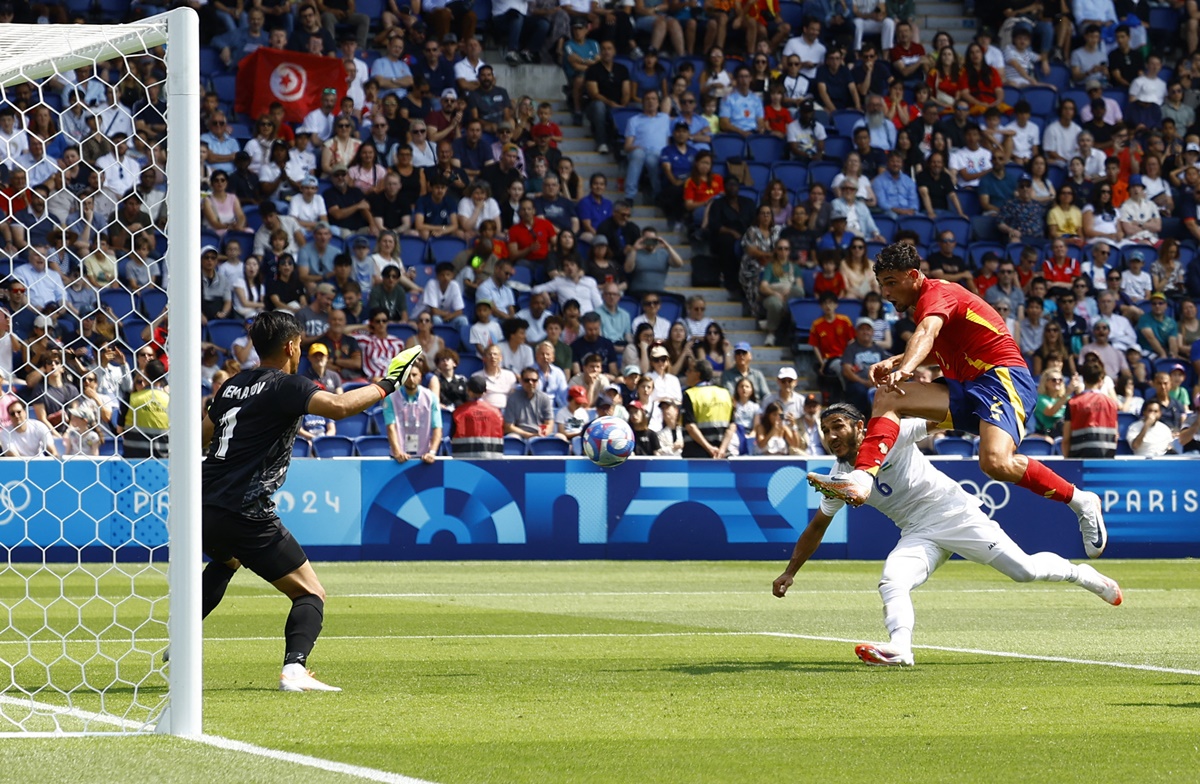 Marc Pubill scores Spain's first goal in the men's Group C match against Uzbekistan at Parc des Princes. 