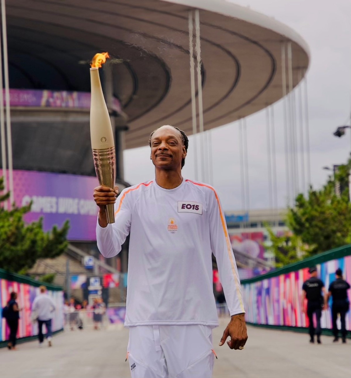 US rapper Snoop Dogg with the Olympic Torch in Paris on Friday