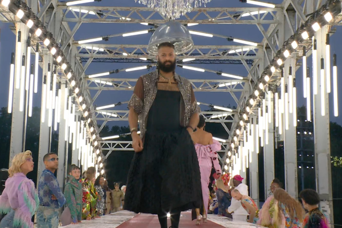 A male model does the catwalk at the opening ceremony
