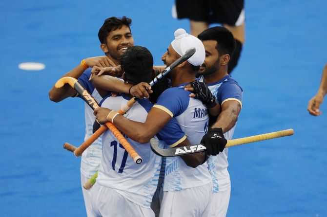 India's players celebrate after Vivek Sagar Prasad scores the second goal.