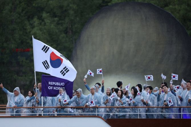 South Korea's athletes aboard a boat in the floating parade on the river Seine during the Paris Olympics opening ceremony on Friday. 