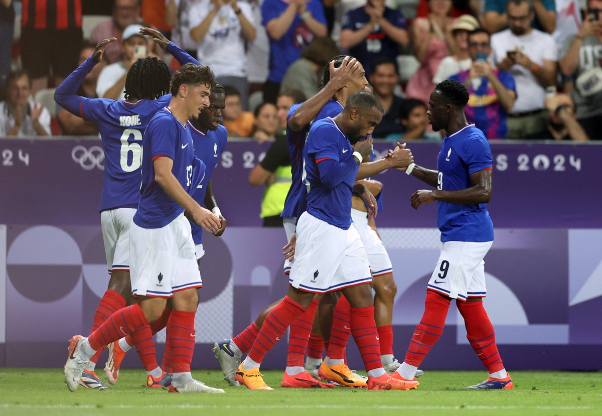 France players celebrate after Kiliann Sildillia scores in the men's Group A match against Guinea, at Nice Stadium.