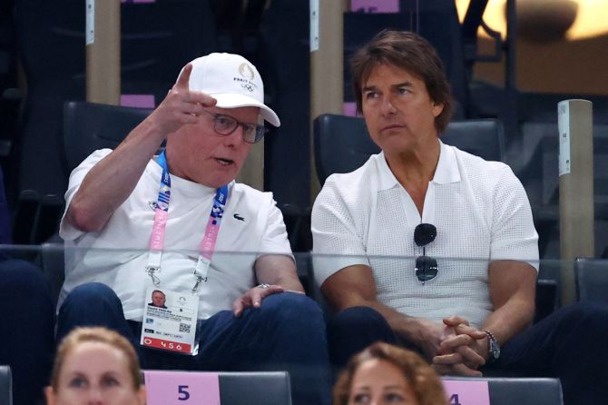 CEO of Warner Bros. Discovery David Zaslav and Actor Tom Cruise in the stands during the Gymnastics Women's Qualification