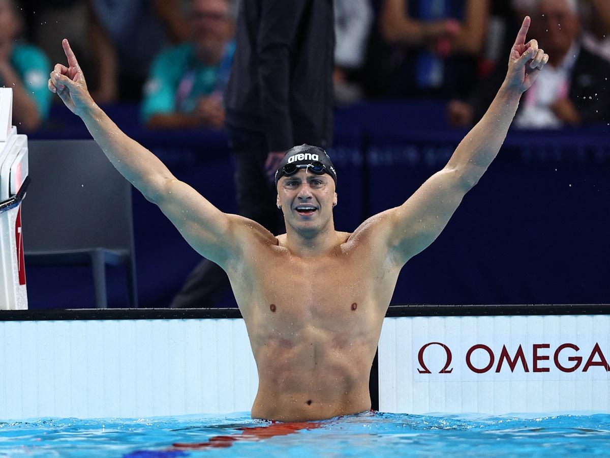 Italy's Nicolo Martinenghi celebrates winning gold in the men's 100m Breaststroke final.