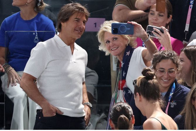 Actor Tom Cruise with fans in the stand during the Artistic Gymnastics Women's Qualification Subdivision 1 at Bercy Arena, Paris, France.