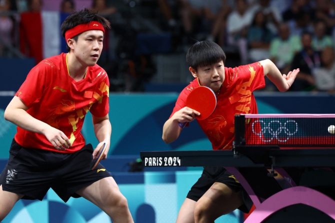 Yingsha Sun of China and Chuqin Wang of China in action with Szu-Yu Chen of Taiwan and Yun-Ju Lin of Taiwan in their Table Tennis Mixed Doubles quarterfinal at South Paris Arena 4, Paris, France at the Paris Olympics,  on Sunday 