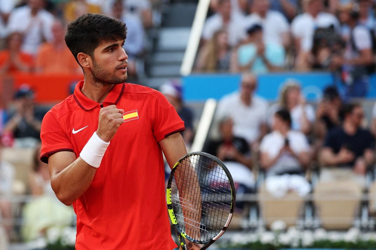 Spain's Carlos Alcaraz reacts after making a winning return against Tallon Griekspoor of the Netherlands.