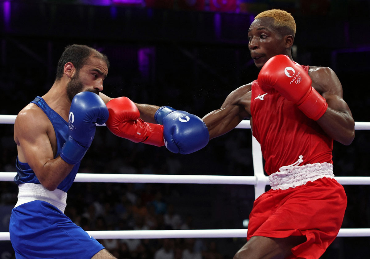 India's Amit Panghal in action against Zambia's Patrick Chiyemba during the Olympics men's boxing 51kg Round of 16 bout, at North Paris Arena, Villepinte, France, on Tuesday.