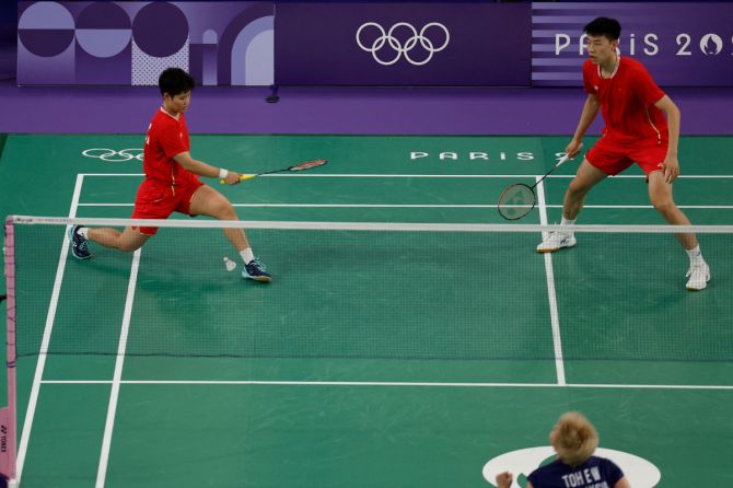 China's Yan Zhe Feng and Dong Ping Huang in action during the Group D match against Malaysia's Tang Jie Chen and Ee Wei Toh.