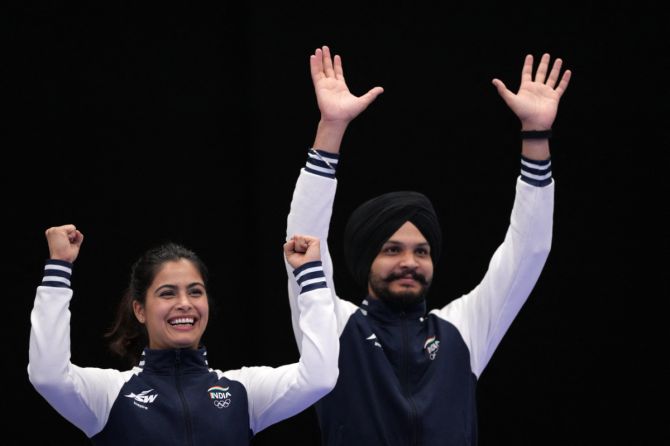 Bronze medallists Manu Bhaker of India and Sarabjot Singh (R) of India on the podium after their 10m Air Pistol Mixed  Medal event at Chateauroux Shooting Centre, Deols, France, on Tuesday