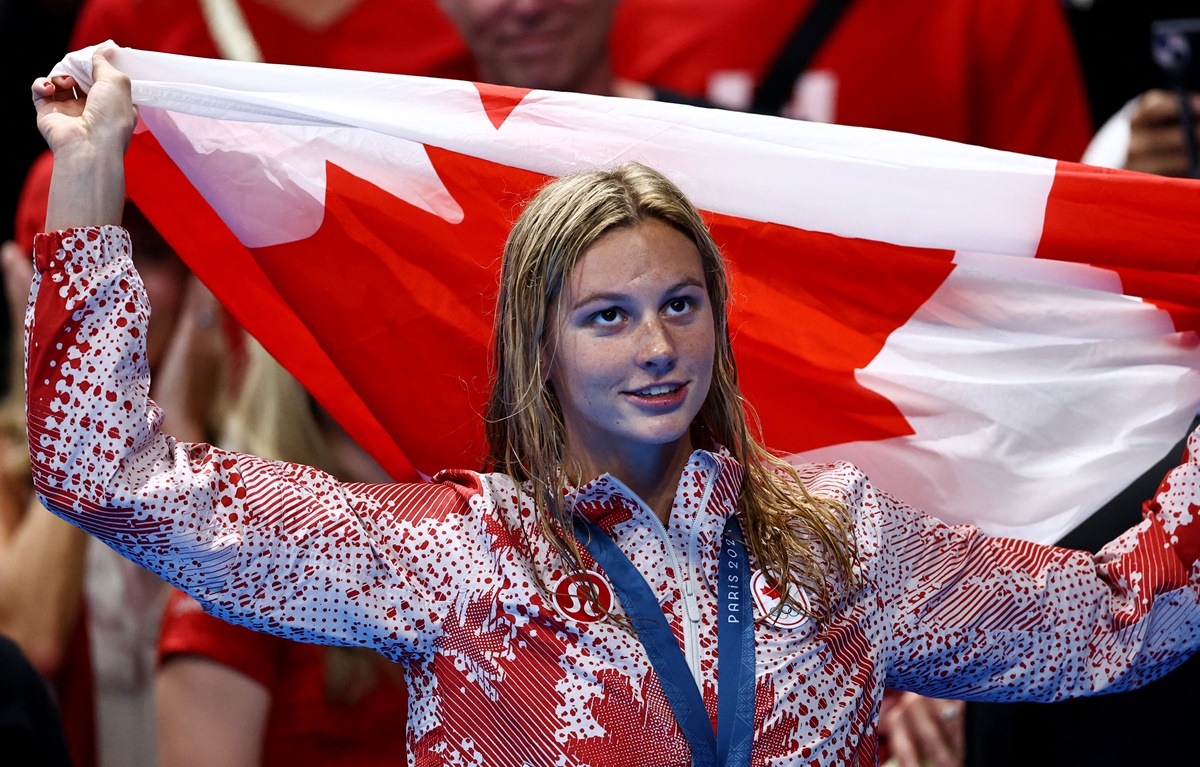 Canada's Summer McIntosh celebrates winning gold in the Olympics swimming women's 400m Individual Medley at Paris La Defense Arena, Nanterre, France, on Monday.