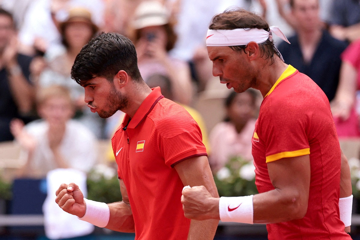 Spain's Carlos Alcaraz and Rafael Nadal react after winnng a point during their men's doubles match against the Netherlands' Tallon Griekspoor and Wesley Koolhof at Roland Garros on Tuesday.