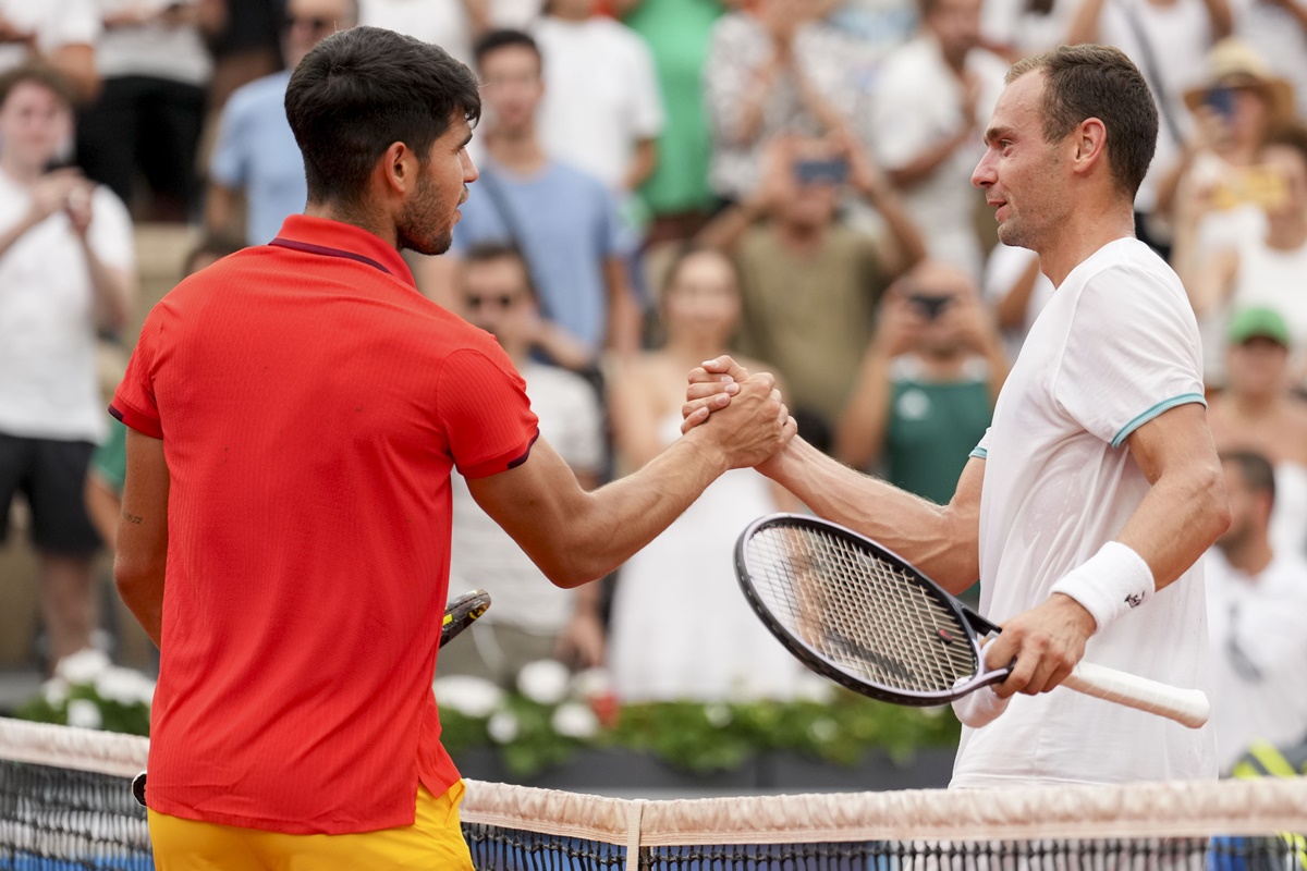 Spain's Carlos Alcaraz is congratulated by Russia's Roman Safiullin after their match.