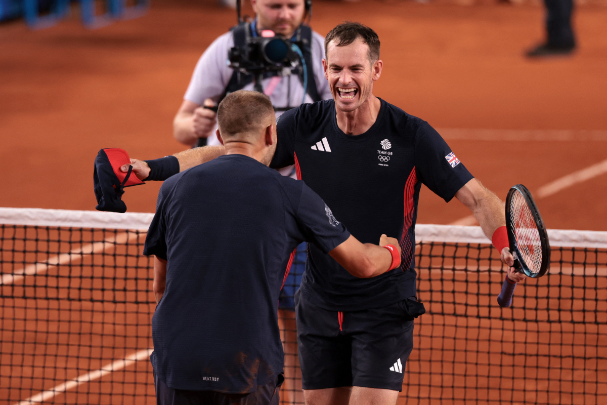 Britain's Andy Murray and Daniel Evans  celebrate after winning their match against Belgium's Sander Gille and Joran Vliegen in the second round of the Men's Doubles event at Roland Garros in Paris at the Olympics on Tuesday.