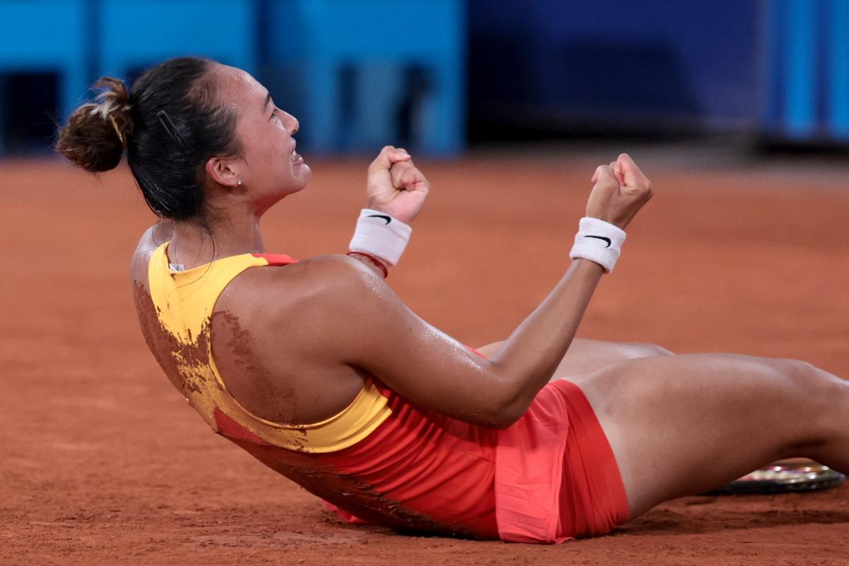 China's Qinwen Zheng celebrates after winning her match against Germany's Angelique Kerber.