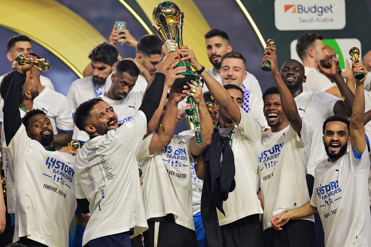 Al Hilal players celebrate with the trophy after defeating Al Nassr and winning the Saudi King Cup final at King Abdullah Sport City, Jeddah, Saudi Arabia, on Friday.