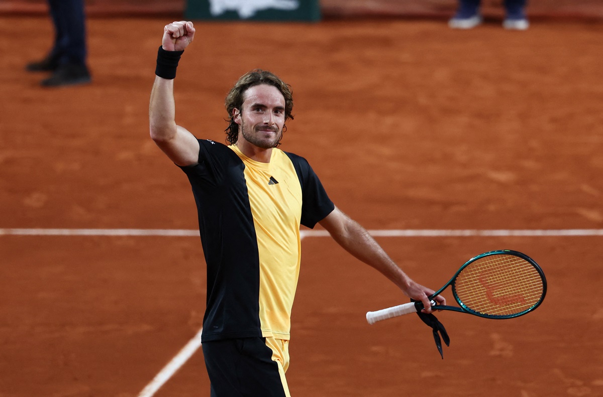 Greece's Stefanos Tsitsipas waves to the crowd after an easy victory over China's Zhang Zhizhen.