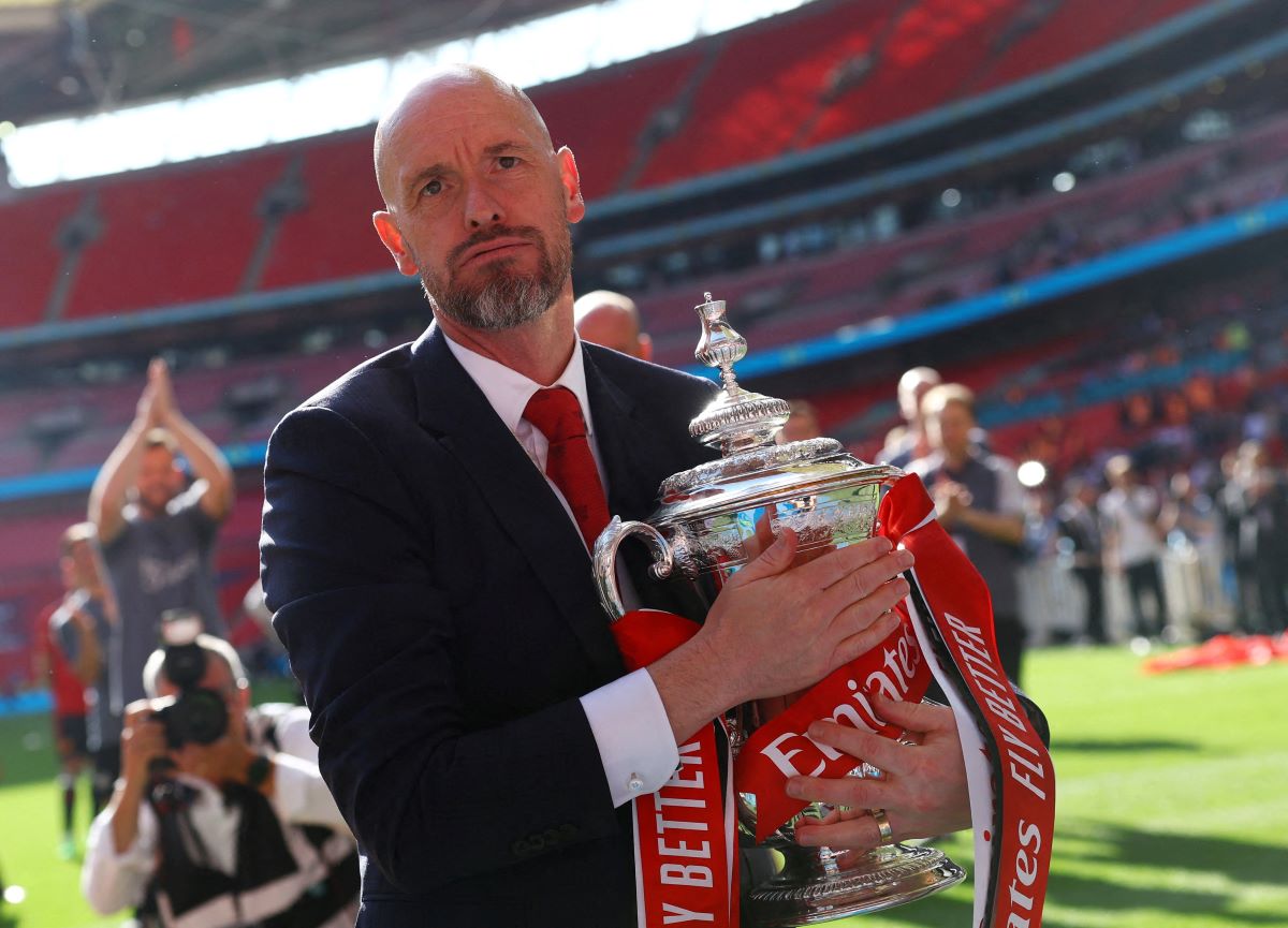 Manchester United manager Erik ten Hag celebrates with the trophy after winning the FA Cup