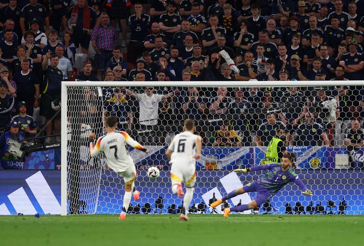Kai Havertz sends Scotland goalkeeper Angus Gunnscores the wrong way from the penalty spot for Germany's third goal.