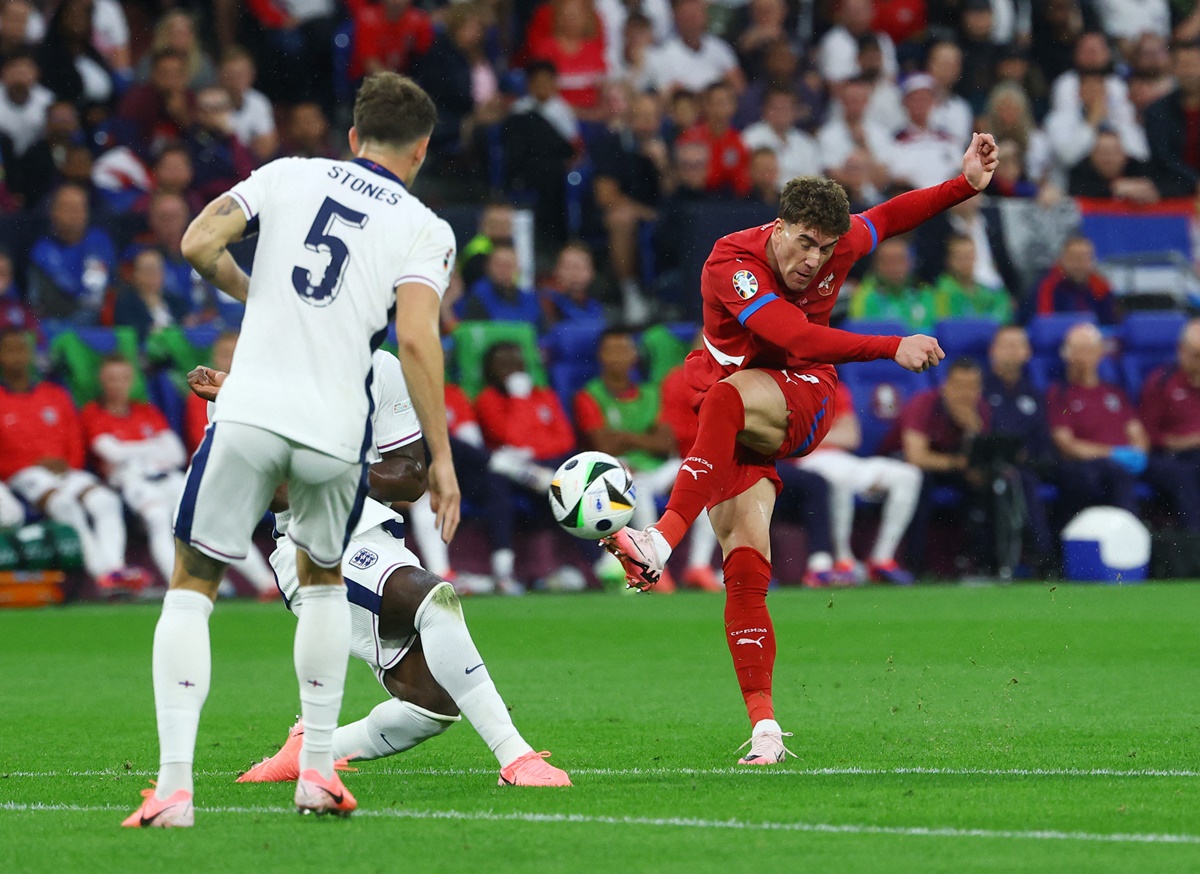 Serbia's Dusan Vlahovic shoots at the England goal.